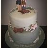 Anniversary cake with models and dogs