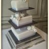 Square wedding cake with slate and icing flowers